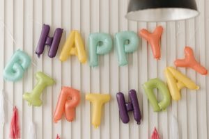 balloon letters spelling happy birthday